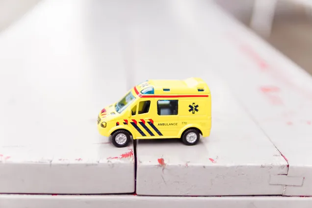 toy ambulance wooden surface 